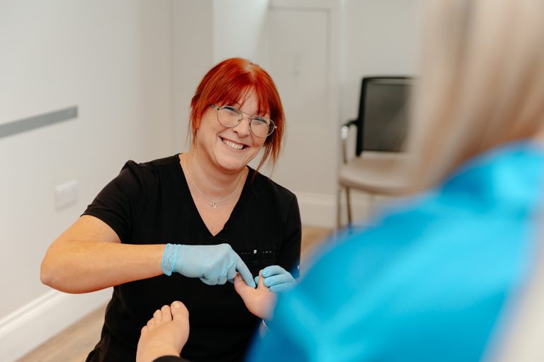 Podiatrist examining foot