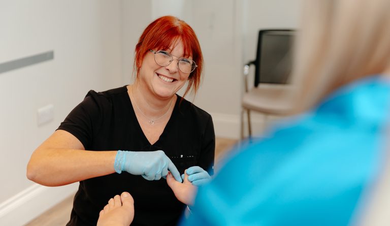 Podiatrist examining foot