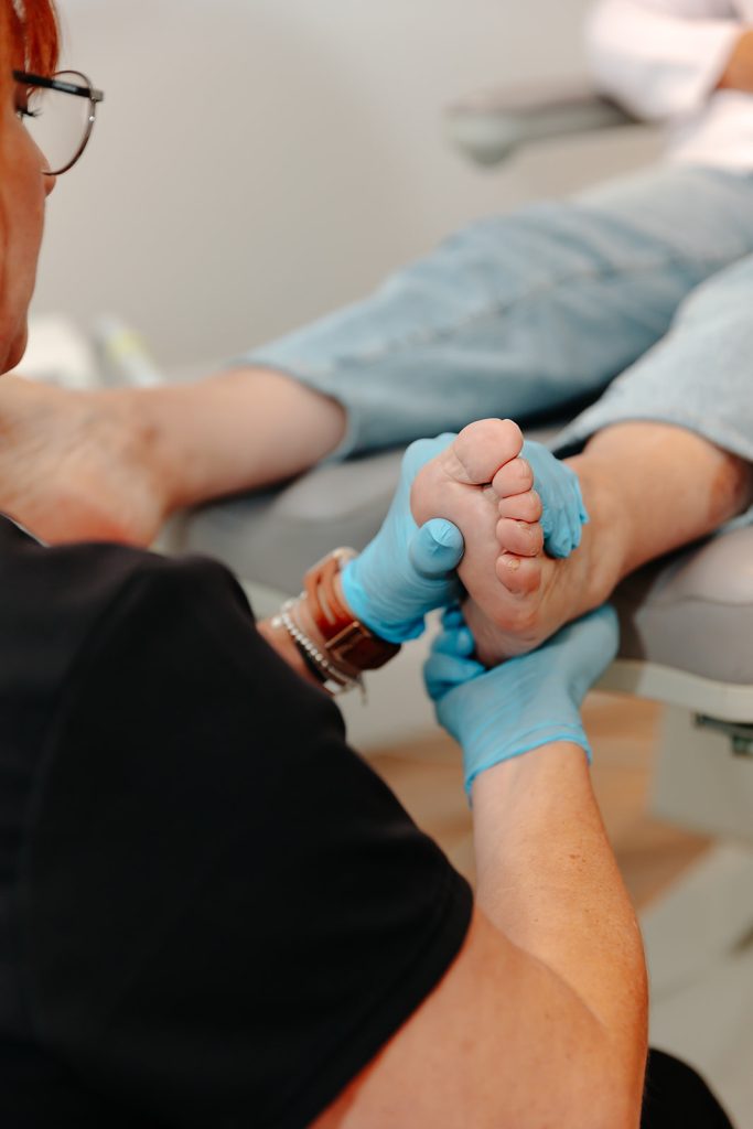 Podiatrist examining foot