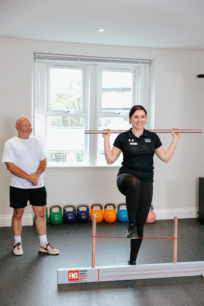 Trainer demonstrating during Rehab at Hatt Clinic